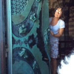 Our lovely sacristan guide, Rita, explaining the church doors